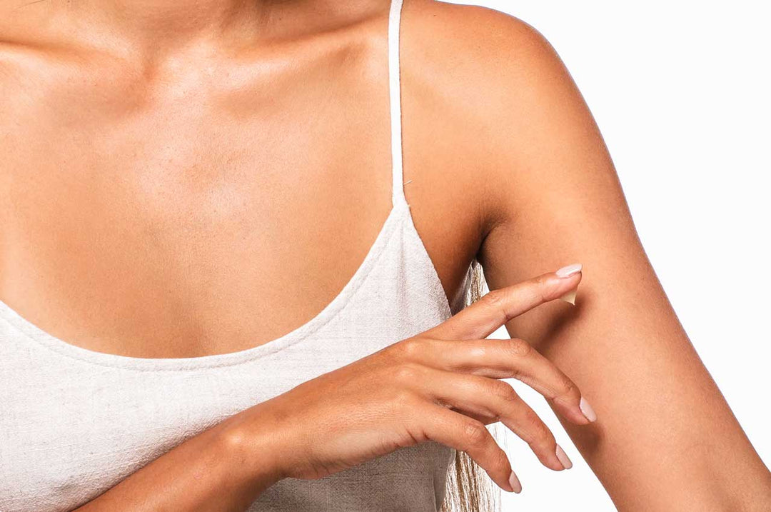 Woman applying Wild Yam cream for menopause symptom relief