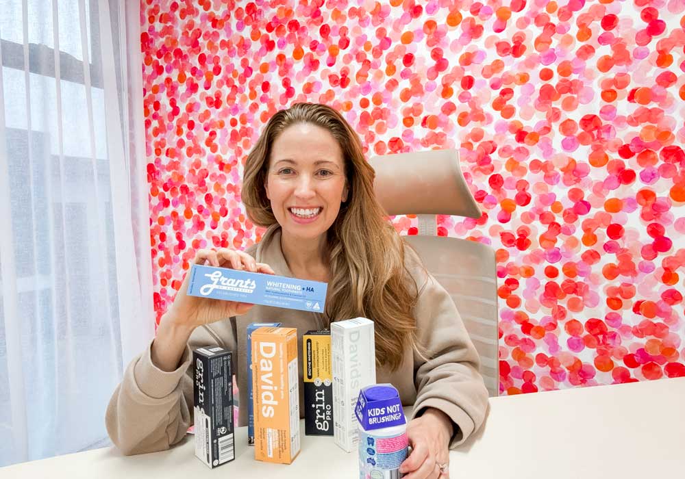 Clean Nectarine Founder Irene Falcone in her office with a range of hydroxyapatite toothpaste 