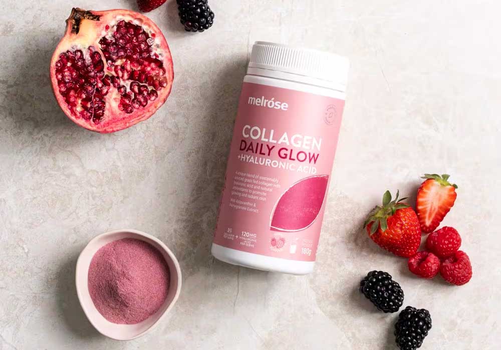 A flat lay image featuring Melrose Collagen Powder with Hyaluronic Acid and fruits