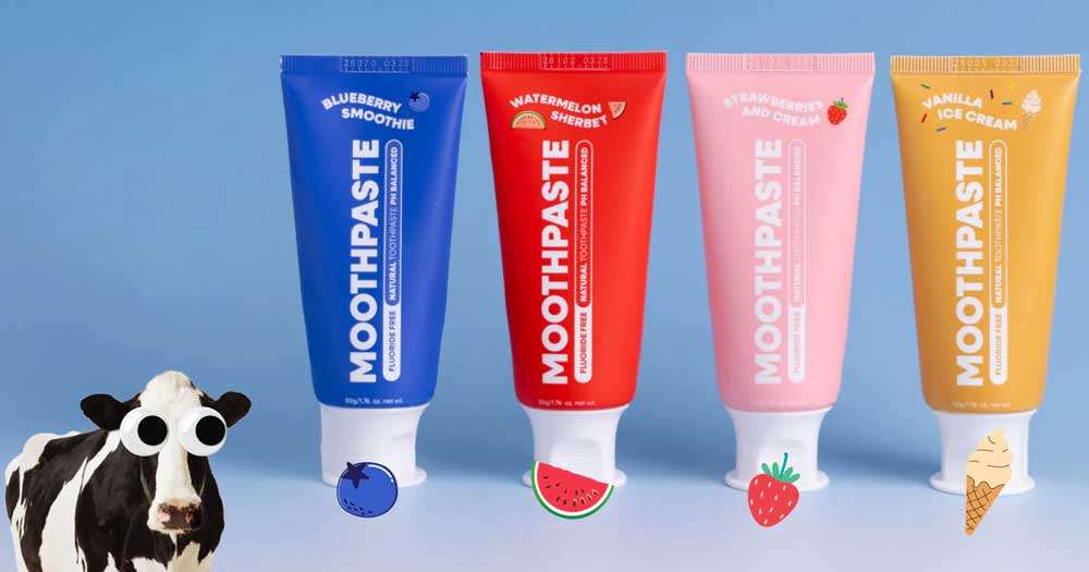 Four colorful toothpaste tubes labeled as blueberry smoothie, watermelon sherbet, strawberry shortcake, and vanilla ice cream, with matching fruit and dessert icons and a cartoon cow on the left.