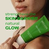 Model applying Weleda Skin Food 100 Years Limited Edition