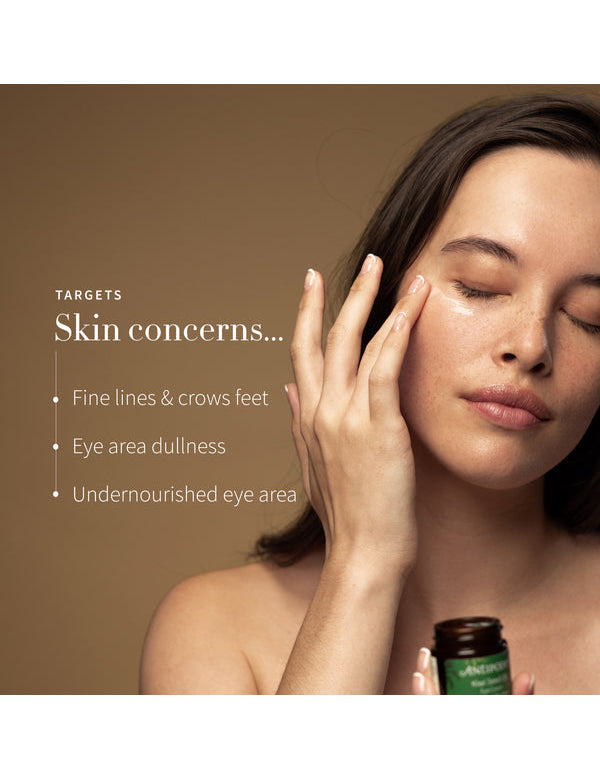 Model applying Antipodes Kiwi Seed Oil Eye Cream with skin concerns listed