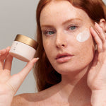 Model applying INIKA Organic Phytofuse Renew Night Cream to her face
