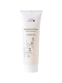 A white tube of 100% Pure Burdock and Neem Healthy Scalp Shampoo by 100% Pure displays floral illustrations and a minimalist, elegant front design.