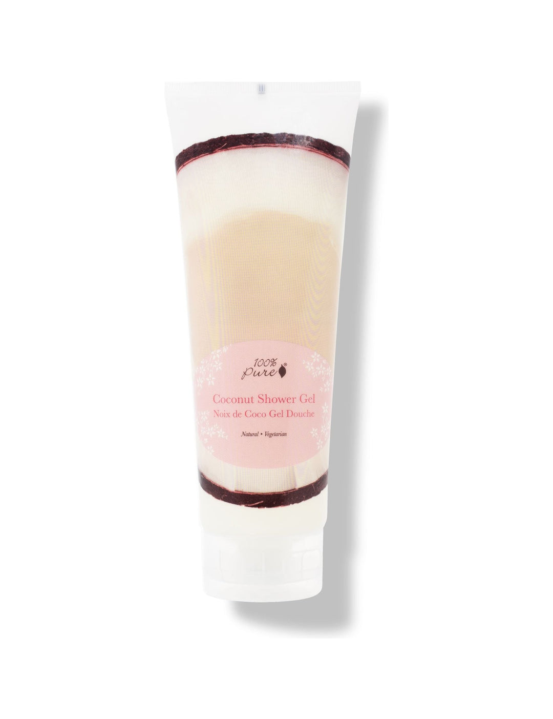 A white 100% Pure Coconut Shower Gel tube stands on a translucent flip-top cap. A pale pink oval label appears over a photograph of white coconut flesh and dark brown shell.