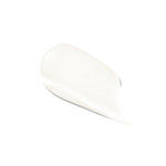 A white swatch of 100% Pure Dark Spot Remover forms a smooth, glossy smear on white. It is rounded and thick at one end, tapering to a fine point at the lower right.