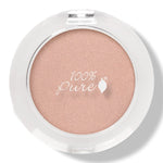 100% Pure Fruit Pigmented Eye Shadow in Flax Seed, showing the pressed powder in its compact on white, with the shade name Flax Seed printed below.