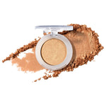 100% Pure Fruit Pigmented Eye Shadow in Gilded, showing an open compact beside a sweep of matching loose powder on white, with the shade name Gilded printed below.