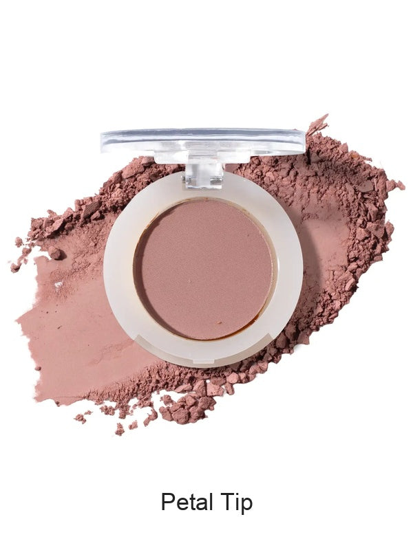 100% Pure Fruit Pigmented Eye Shadow in Petal Tip, showing an open compact beside a sweep of matching loose powder on white, with the shade name Petal Tip printed below.
