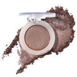 100% Pure Fruit Pigmented Eye Shadow in Quartz, showing an open compact beside a sweep of matching loose powder on white, with the shade name Quartz printed below.