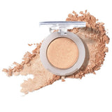 100% Pure Fruit Pigmented Eye Shadow in Star Bright, showing an open compact beside a sweep of matching loose powder on white, with the shade name Star Bright printed below.