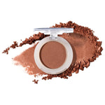 100% Pure Fruit Pigmented Eye Shadow in Sugared, showing an open compact beside a sweep of matching loose powder on white, with the shade name Sugared printed below.