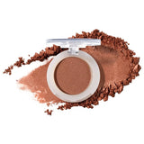 100% Pure Fruit Pigmented Eye Shadow in Sugared, showing an open compact beside a sweep of matching loose powder on white, with the shade name Sugared printed below.