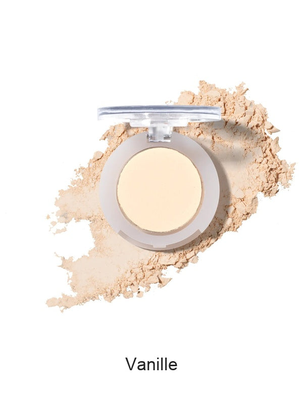 100% Pure Fruit Pigmented Eye Shadow in Vanille, showing an open compact beside a sweep of matching loose powder on white, with the shade name Vanille printed below.