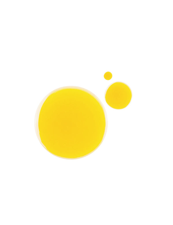 Three round drops of bright golden-yellow 100% Pure Multi-Vitamin + Antioxidants PM Facial Oil on white, with one large pool and two smaller drops above it.