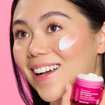 Model applying Andalou 1000 Roses Biome Balancing Day Cream