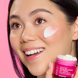 Model applying Andalou 1000 Roses Biome Balancing Day Cream