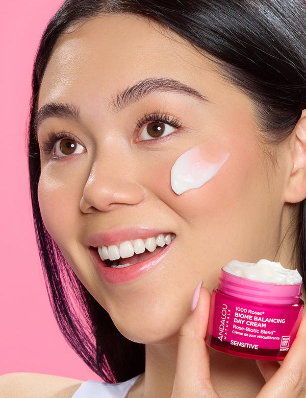 Model applying Andalou 1000 Roses Biome Balancing Day Cream