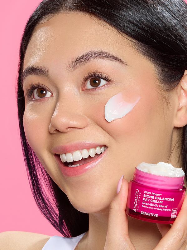Model applying Andalou 1000 Roses Biome Balancing Day Cream