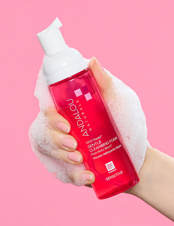 Andalou Sensitive 1000 Roses Gentle Cleansing Foam pump bottle held in hand