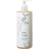 A clear pump bottle labeled 100% Pure Glossy Locks Grow More Shampoo features botanical line art on white. This hair growth shampoo by 100% Pure contains a light amber liquid to help support thicker, fuller-looking hair.
