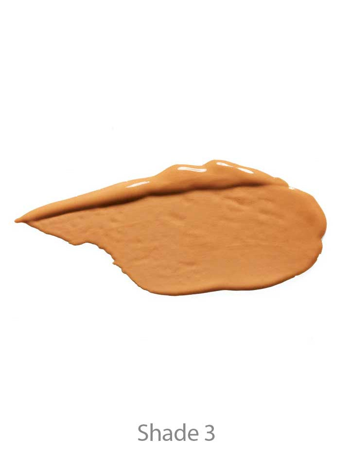 A swatch of 100% Pure 2nd Skin Concealer 5ml in Shade 3, a medium tan tone, sits on a white background, highlighting its natural finish formula.