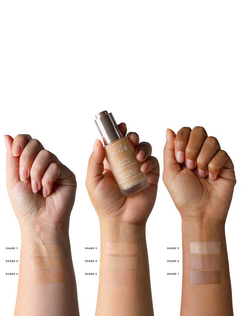 Three hands of varying skin tones show four swatches each (Shade 1-8) of the 100% Pure 2nd Skin Serum Foundation (35ml) on their forearms, with one holding the bottle. Each swatch reveals this ultralight foundation’s natural, seamless coverage.