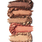 Five swatches of crushed powder eyeshadow from the 100% Pure Fruit Pigmented® Better Naked Palette 9g, showcasing brown, bronze, and peach shades, are arranged in horizontal smears on a white background.