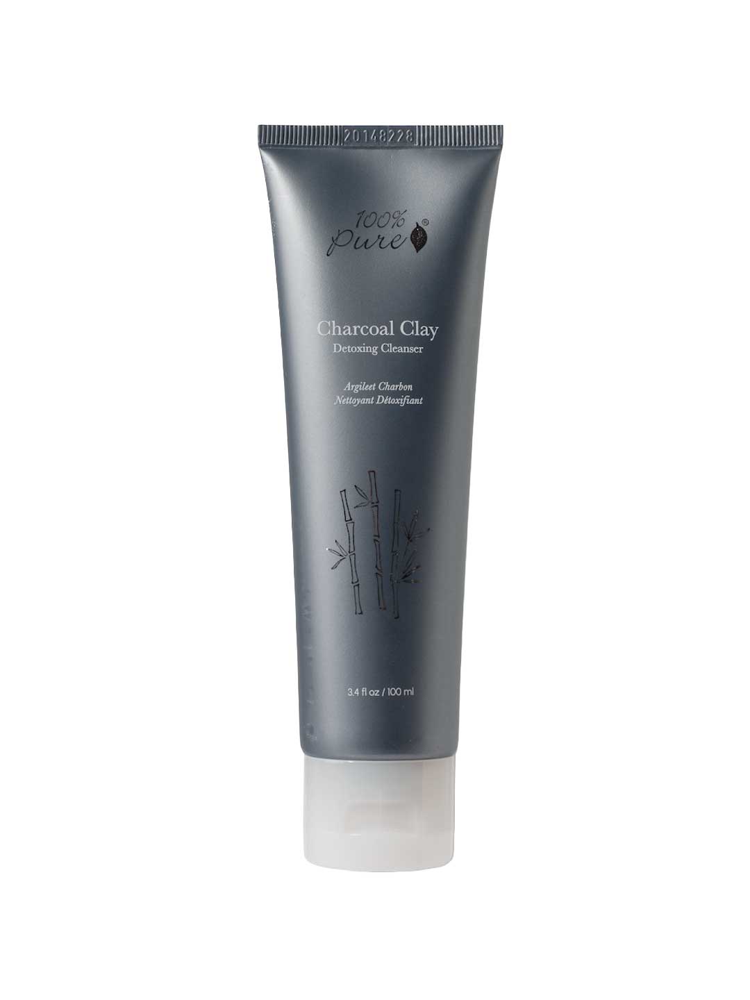 A gray tube labeled 100% Pure Charcoal Clay Cleanser, featuring white text, a bamboo illustration, and a clear cap. This 80ml cleanser by 100% Pure deeply purifies your skin with detoxifying charcoal clay.