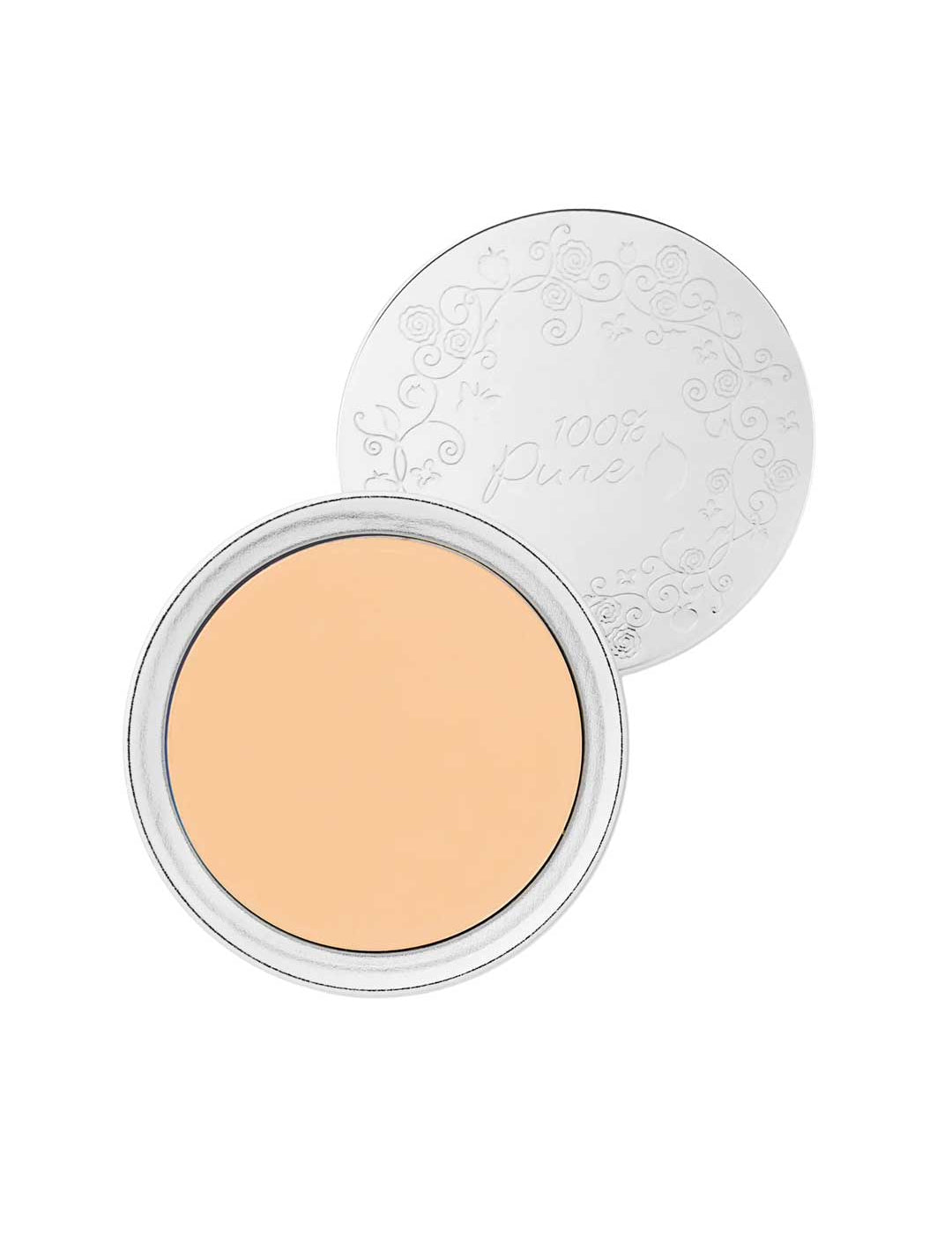 A compact of 100% Pure Cream Foundation 9g sits open, revealing smooth, pale beige vegan powder. Behind it is a silver lid embossed with a floral design and the words "100% Pure.