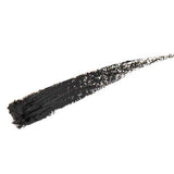 A bold, thick black brushstroke sweeps diagonally across a white background, echoing the intense, long-lasting look of 100% Pure Creamy Long Last Eye Liner 1.14g with its textured, slightly smudged finish.