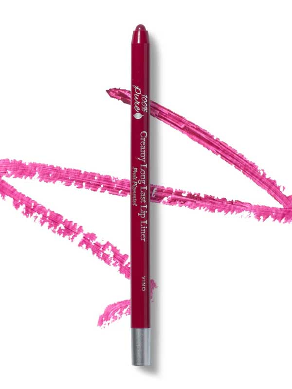 A pink 100% Pure Creamy Long Last Lip Liner 1.14g pencil rests on a white surface, surrounded by vivid pink lip liner swatches.