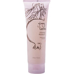 A light pink 8 fl oz (236 ml) tube of 100% Pure Glossy Locks Glossing Shampoo by 100% Pure, with a flip-top cap and simple line art of pomegranate branches and fruit.