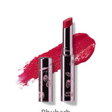 A metallic tube of 100% Pure Fruit Pigmented® Lip Glaze 2.5g by 100% Pure, featuring a floral design and deep red Rhubarb shade. A color swatch is displayed behind the tube on a white background.