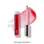 A tube of 100% Pure Fruit Pigmented® Lip Gloss (4.17ml) in red with a wand applicator, some gloss swiped beside it and labeled Pomegranate Wine, is shown on a white background.