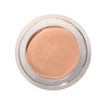 A top view of the 100% Pure Fruit Pigmented® Long Last Concealer with Super Fruits 3g by 100% Pure, a light beige vegan formula in a clear round jar with a silver rim—ideal for achieving a flawless finish.