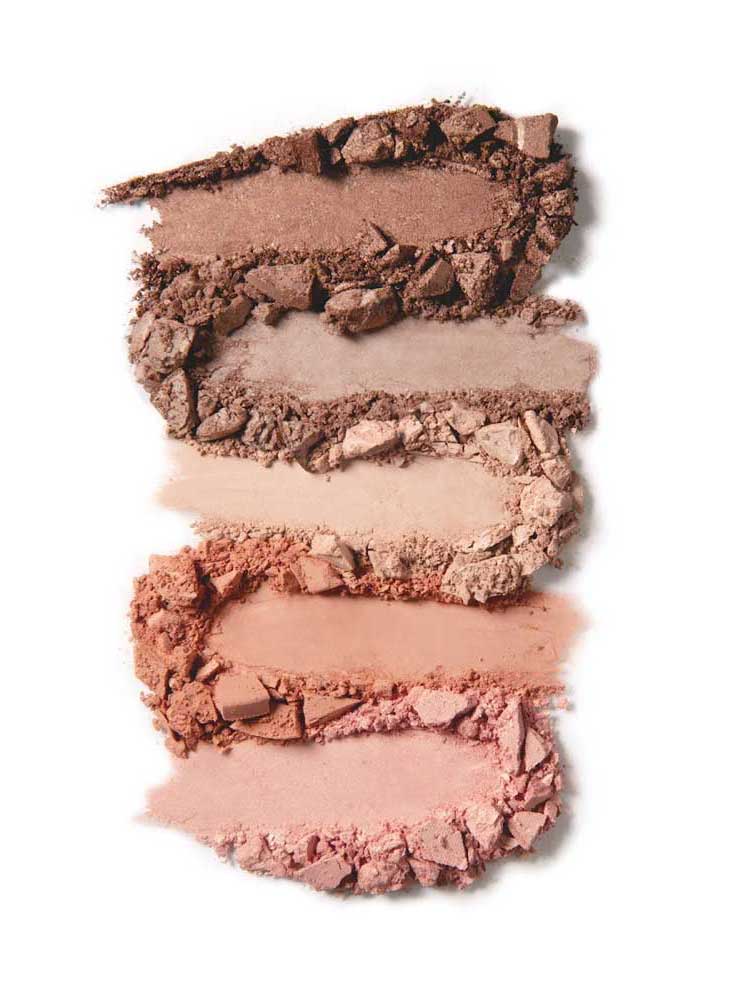 Four smudged and crushed powders from the 100% Pure Pretty Naked Palette 9g in brown and pink shades are arranged vertically on a white background, highlighting this versatile neutral eyeshadow palette.