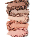 Four swatches of 100% Pure's 100% Fruit Pigmented® Pretty Naked Palette 9g—broken pressed powder in nude and brown shades—are arranged vertically on a white background, perfect for everyday makeup.