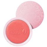 The 100% Pure Rice Powder Pressed Blush 9g is a round pink compact with "100% Pure" embossed on the powder and floral designs on the open lid, shown on a white background. Achieve a natural flush with this vegan blush.