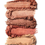 Five horizontal smudges of 100% Pure 100% Fruit Pigmented® Rose Gold Palette eyeshadows in shades from light beige to deep bronze, brown, peach, and gold displayed on a white background.
