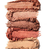 Five swatches of the 100% Pure Rose Gold Palette 9g, in brown, bronze, and rose tones, are displayed vertically on a white background. This vegan eyeshadow offers matte and shimmery finishes for long-lasting wear.
