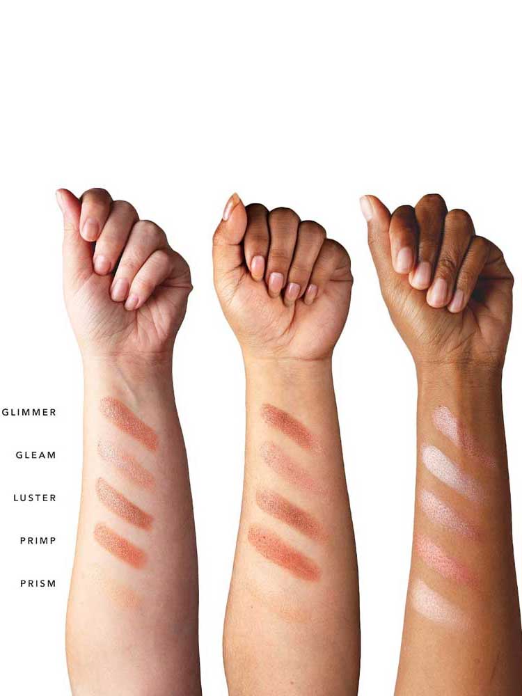Three raised arms with varying skin tones show off five shimmery shades—Glimmer, Gleam, Luster, Primp, and Prism—from the 100% Pure Rose Gold Palette 9g, highlighting color variety and lasting wear on every complexion.