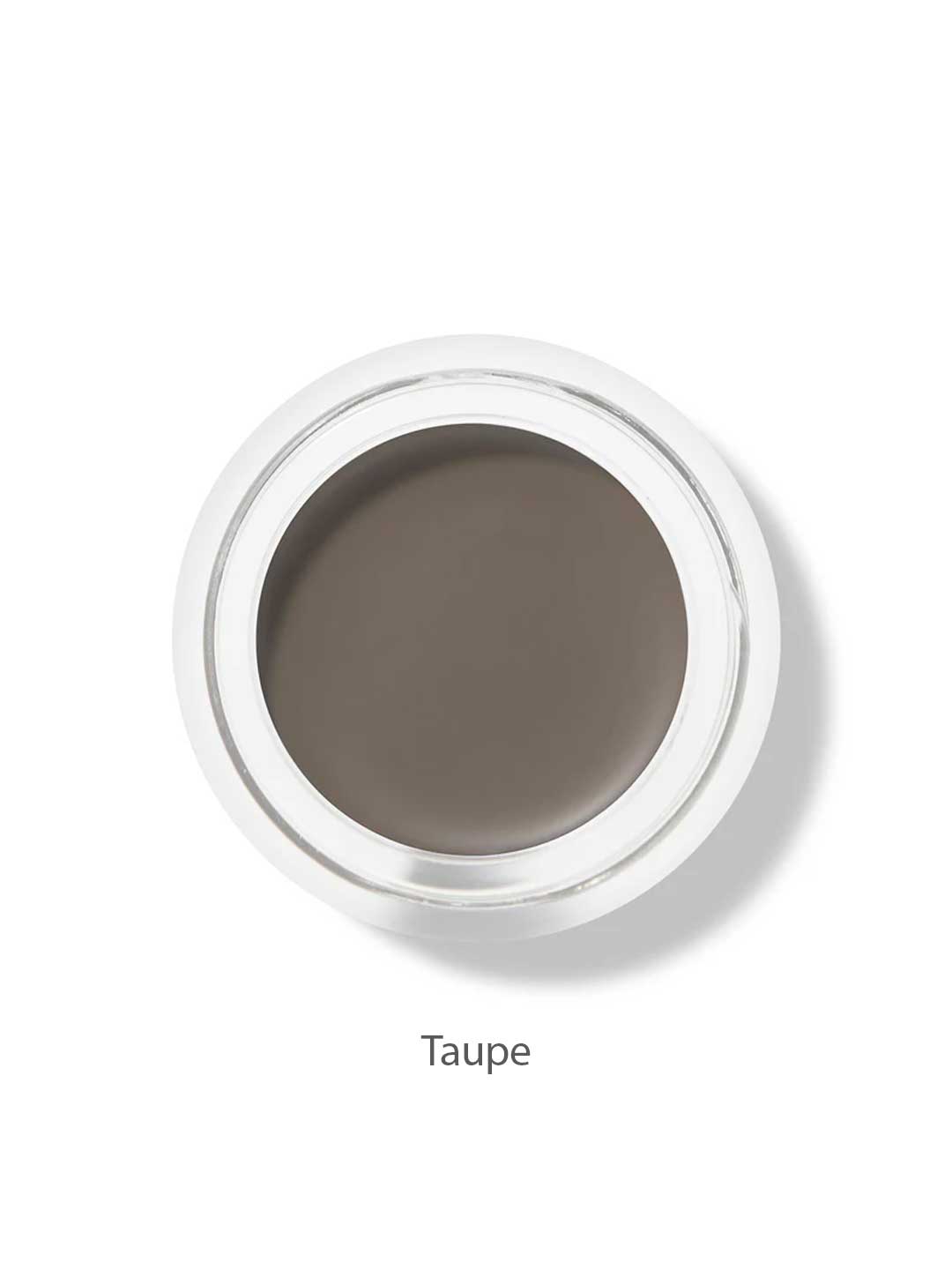 A small round pot of 100% Pure Long Last Brows 4.5g by 100% Pure, filled with taupe long-lasting cream, is viewed from above. The word "Taupe" appears below the container on a white background.