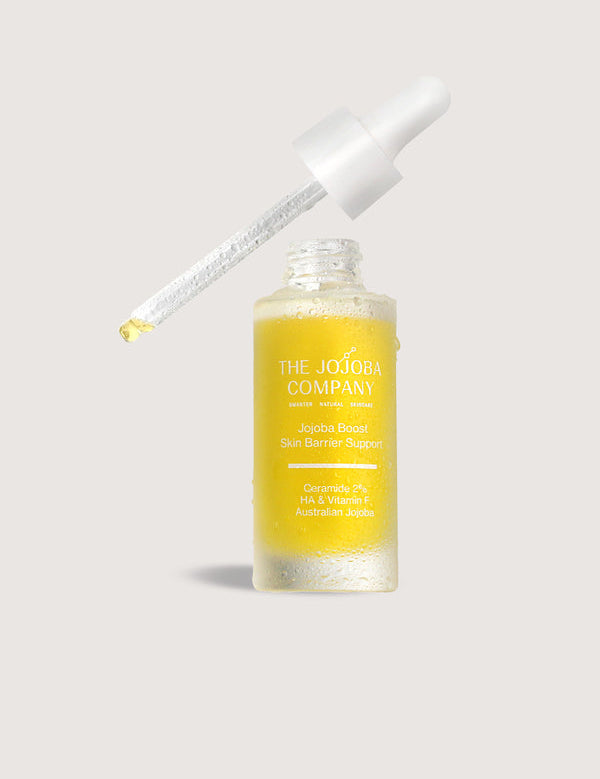 The Jojoba Company Jojoba Boost Skin Barrier Support dropper bottle lifestyle photo