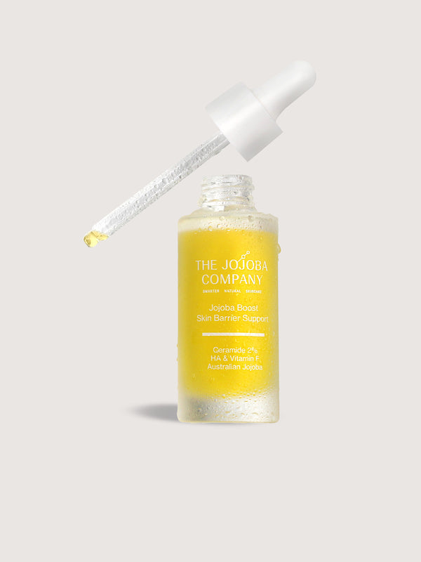 The Jojoba Company Jojoba Boost Skin Barrier Support dropper bottle lifestyle photo