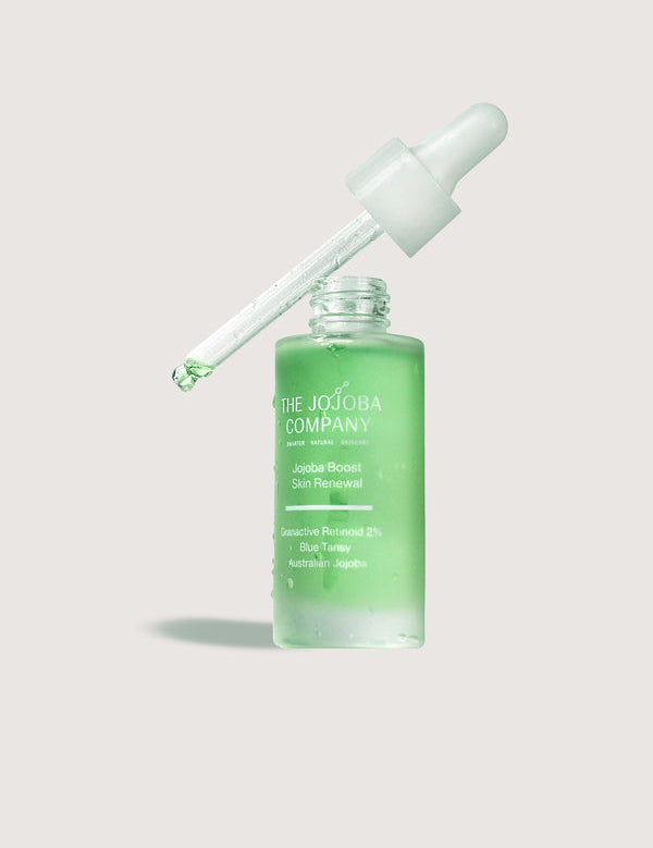The Jojoba Company Jojoba Boost Skin Renewal dropper bottle with green serum