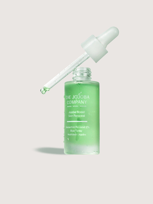 The Jojoba Company Jojoba Boost Skin Renewal dropper bottle with green serum
