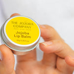 The Jojoba Company Jojoba Lip Balm in use