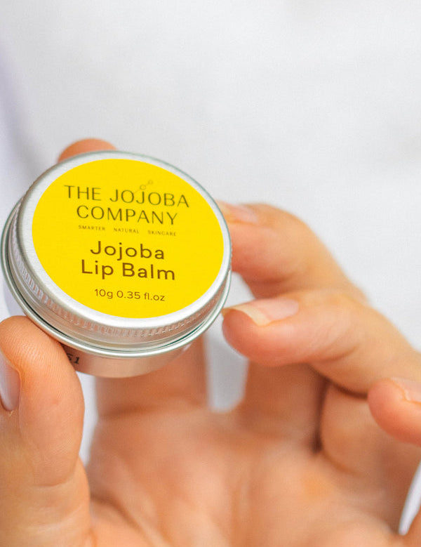 The Jojoba Company Jojoba Lip Balm in use