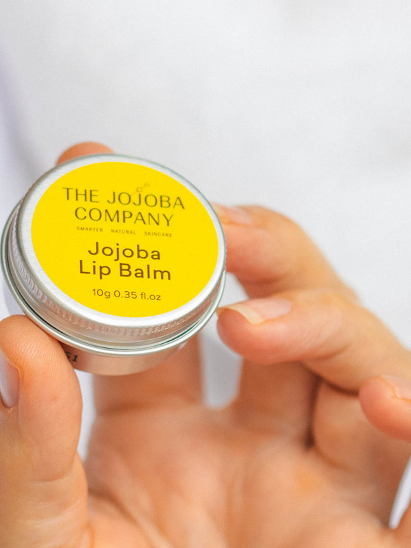 The Jojoba Company Jojoba Lip Balm in use